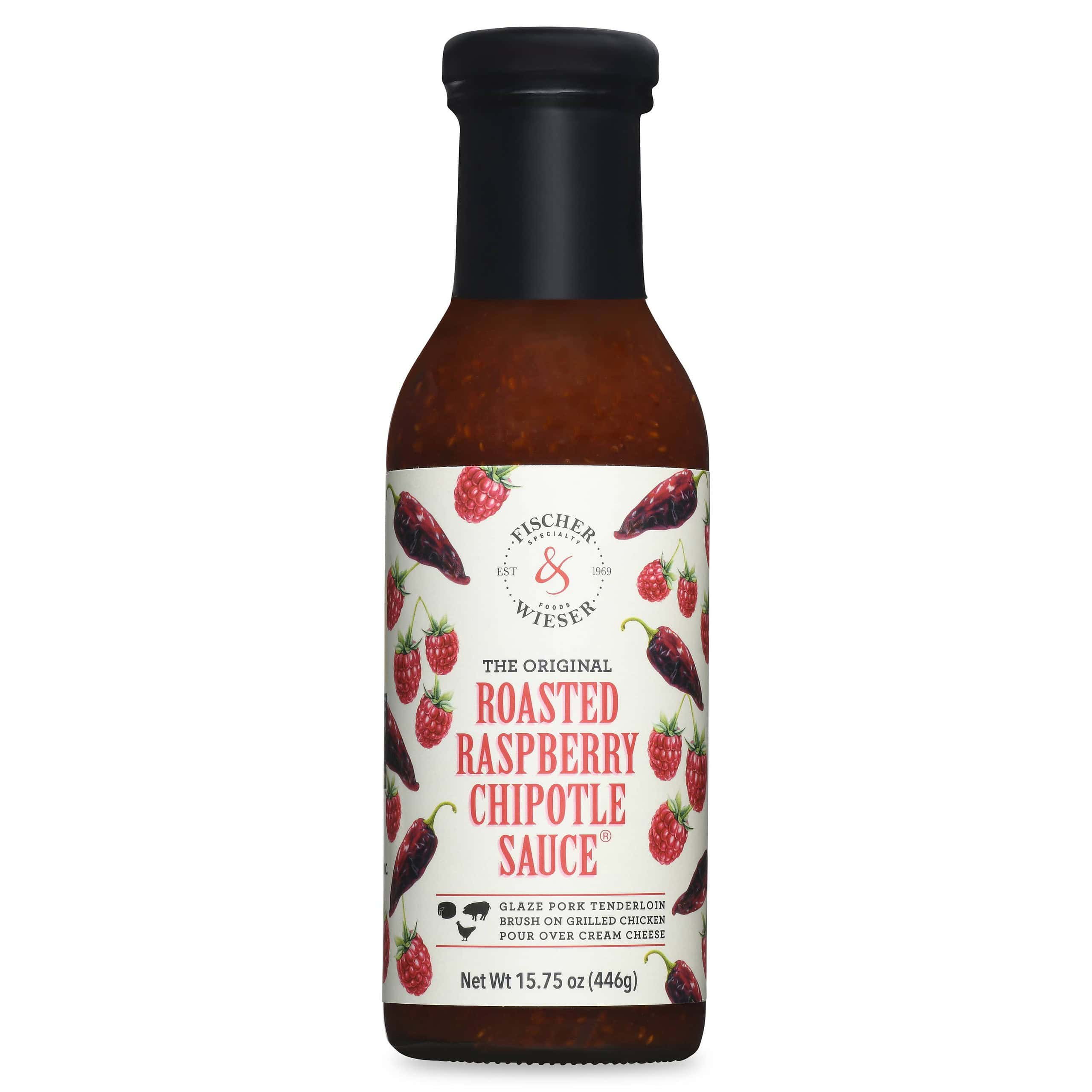 Roasted raspberry chipotle sauce bottle with label highlighting flavors and ingredients.