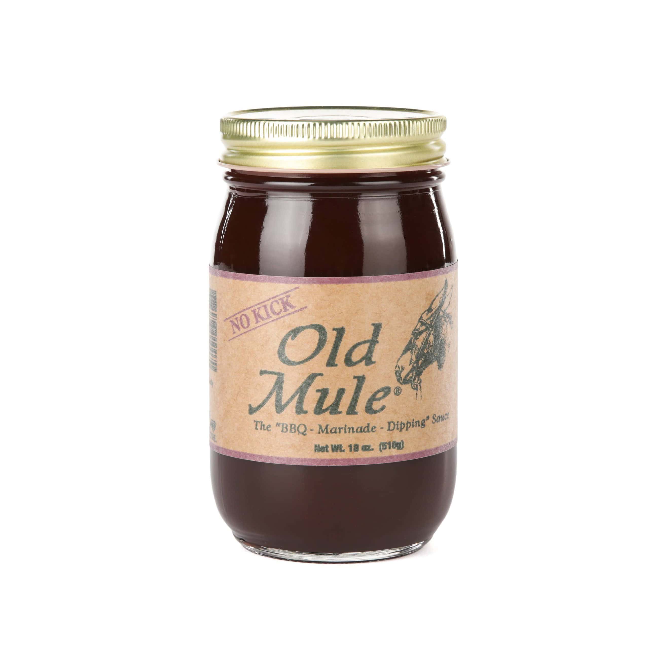 Old Mule BBQ Marinade and Dipping Sauce in a glass jar, ideal for outdoor grilling and barbecue.
